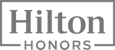 The image shows the Hilton Honors logo, featuring "Hilton" in large font and "HONORS" below it, both inside a rectangular frame.
